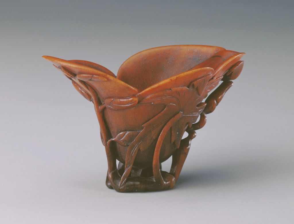 图片[1]-Rhinoceros horn carved okra leaf pattern magnolia flower cup-China Archive